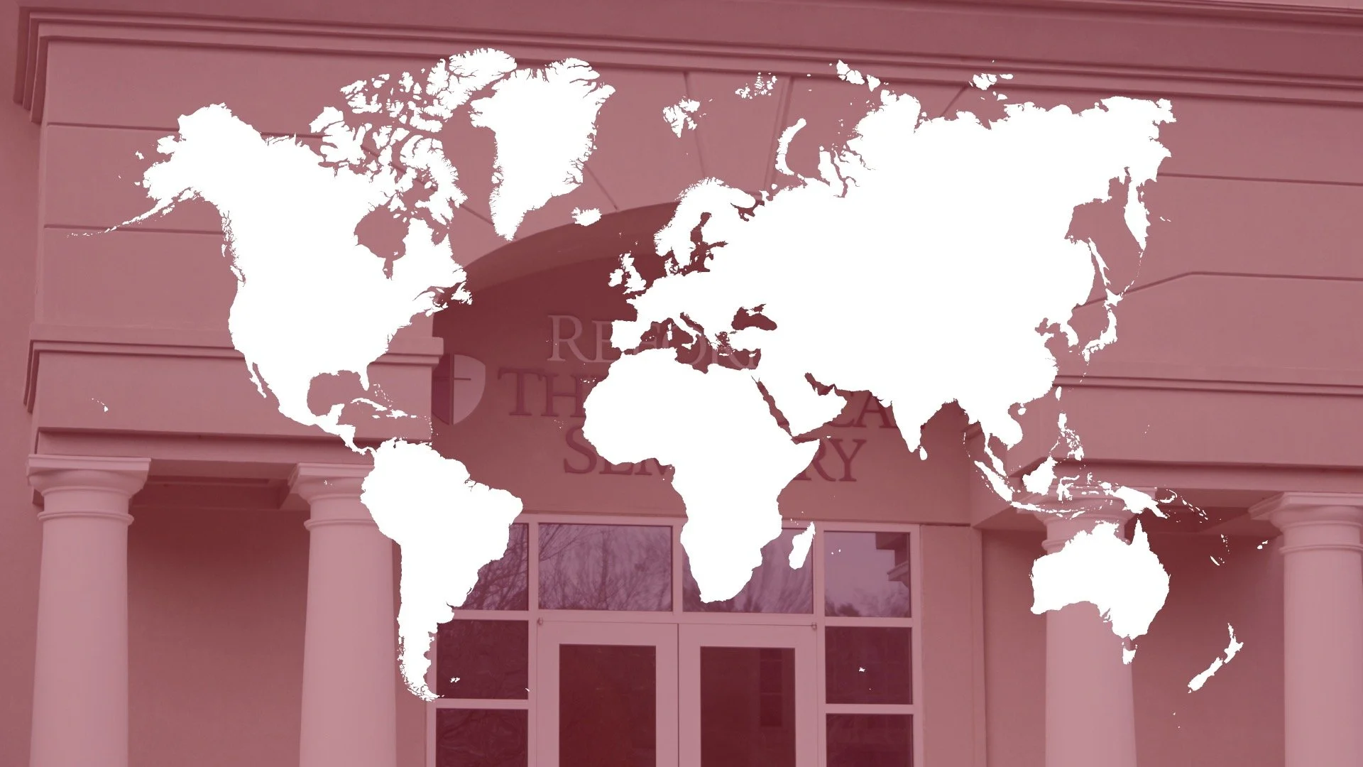 World map over a pink building with columns and windows.