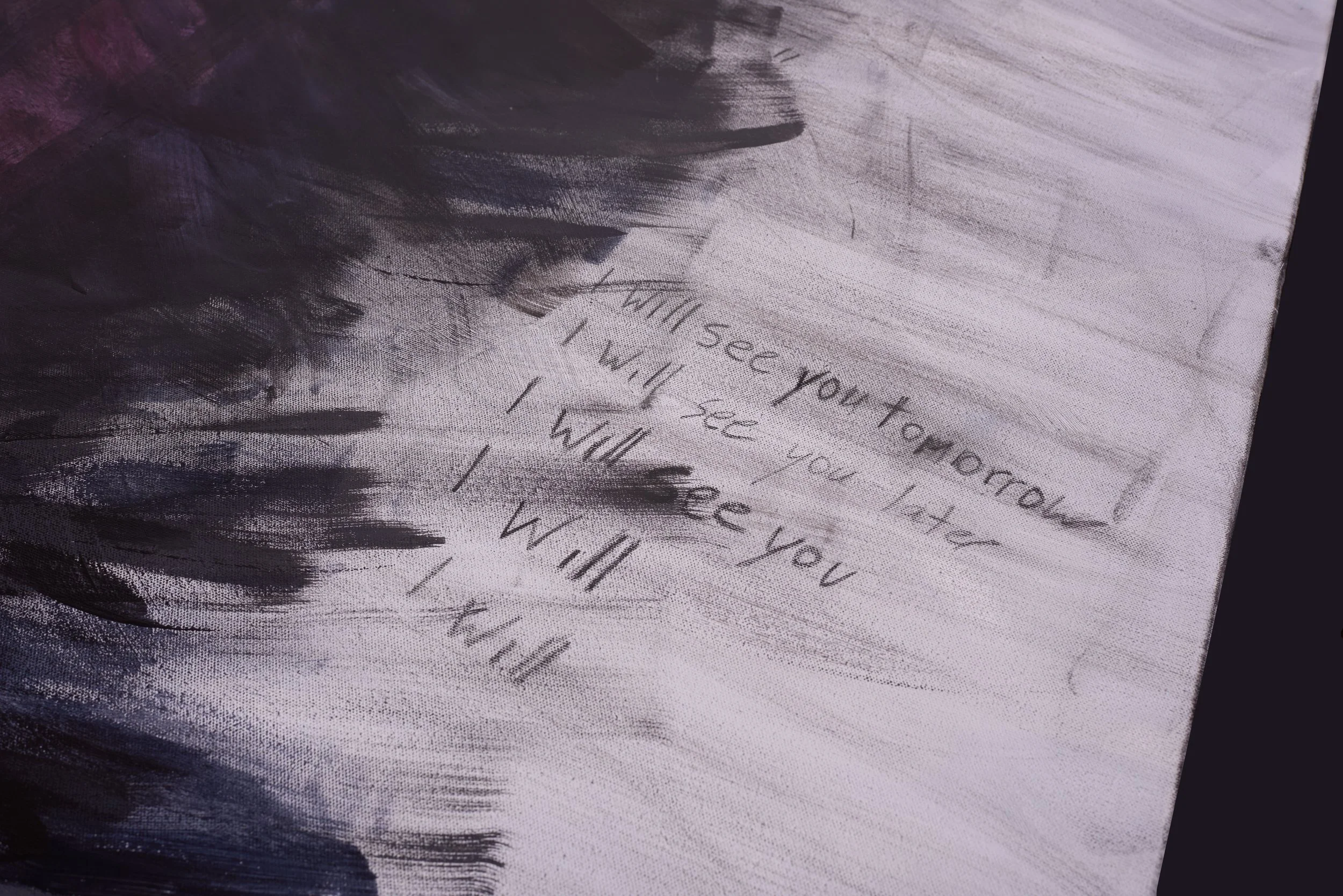 Close-up of a partially visible painting with dark brushstrokes and faint handwritten text that reads, "I see you."