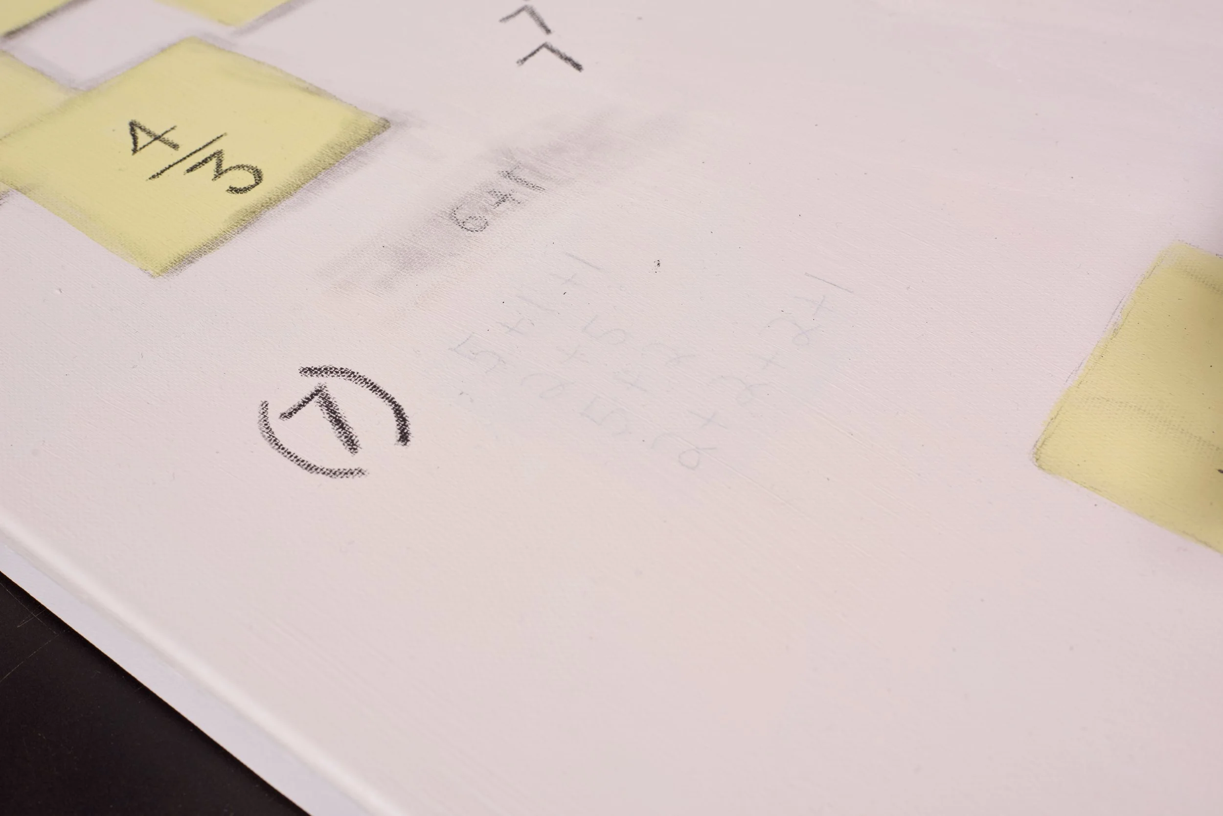 Close-up of a piece of paper with a yellow sticky note and part of a printed circuit diagram. The sticky note displays '4/4' and there are printed circuit symbols on the paper.