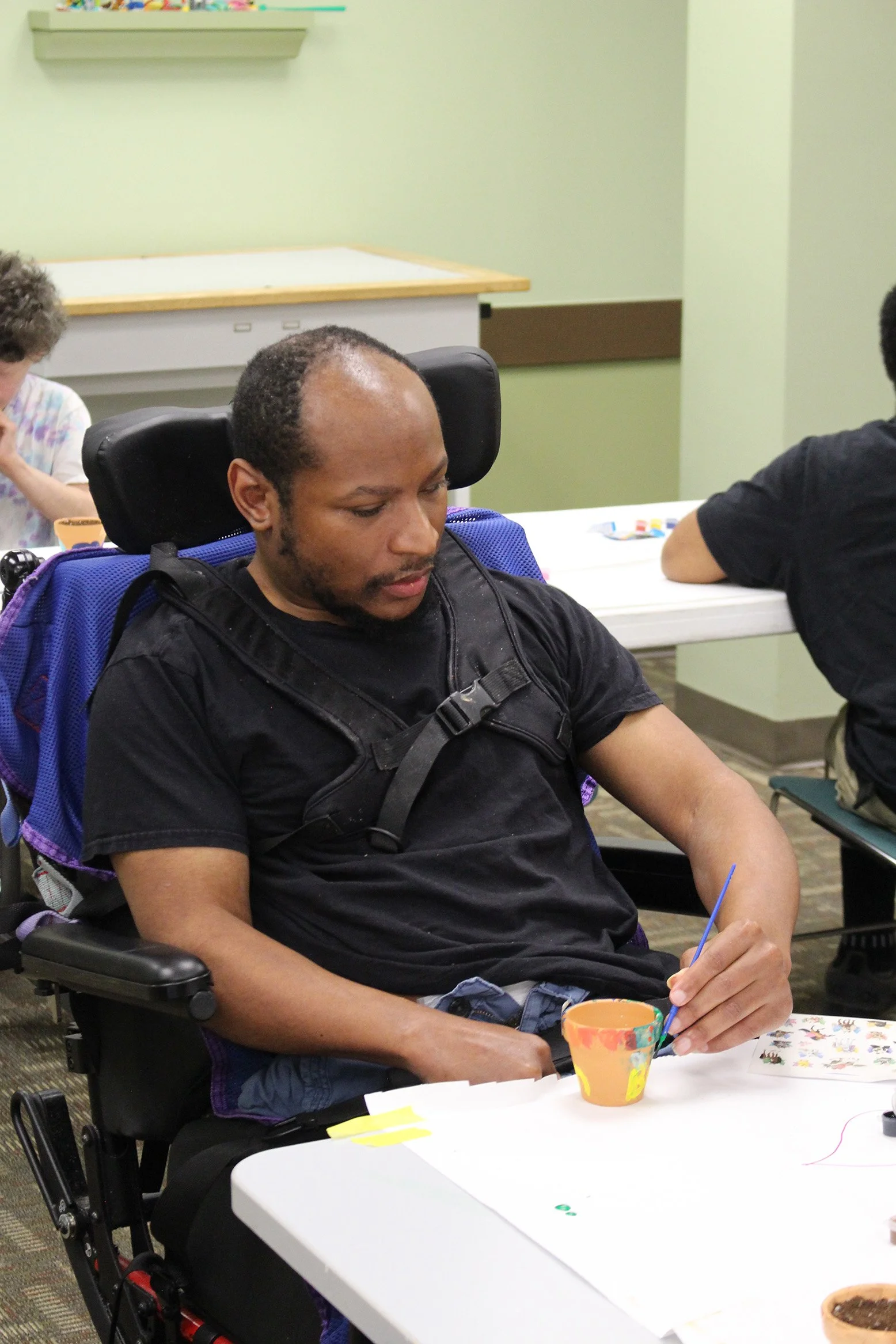 Developmental disabied person doing arts & crafts 
