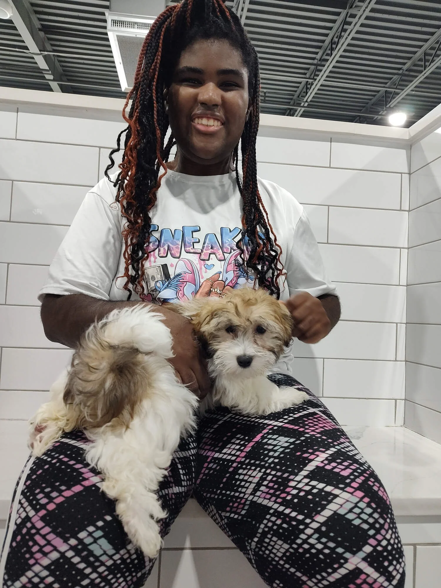 Developmentally disabled adult holding a dog