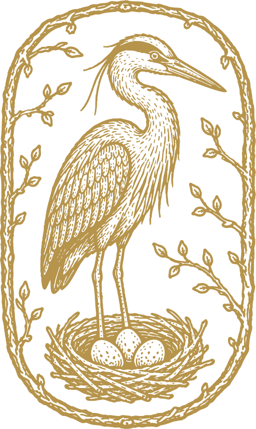 Gold-colored heron standing in a nest with three eggs, surrounded by a decorative vine border.