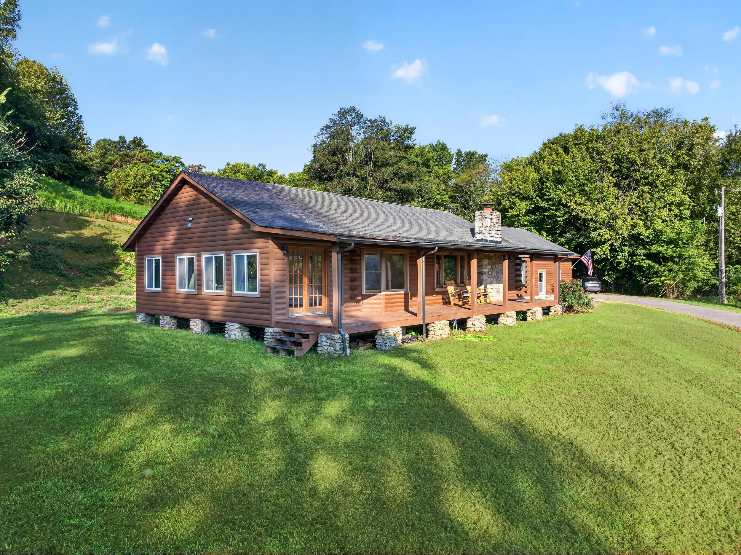 Refuge Ranch on the bright green grass with blue sky's.