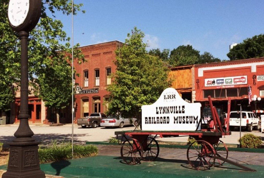 Historic wagon and storefronts in downtown Lynnville, Tennessee.