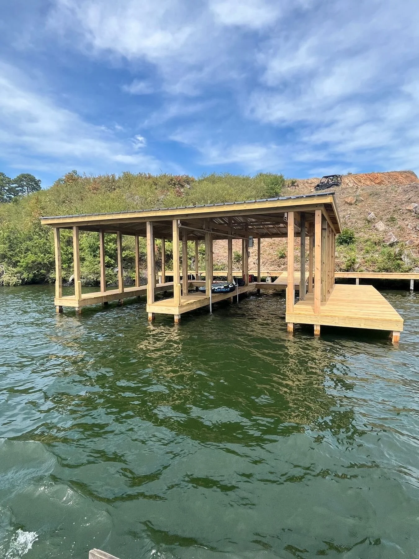 Covered boat dock with a boat lift on Lake Hamilton
