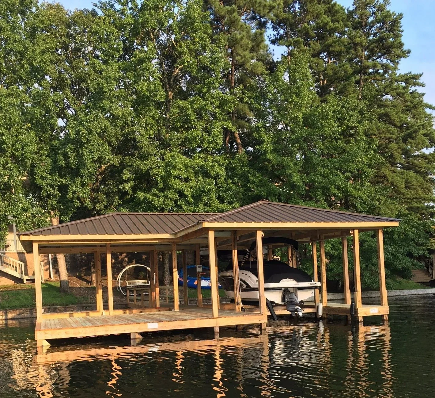 Covered stationary boat dock with timber frame on Lake Hamilton