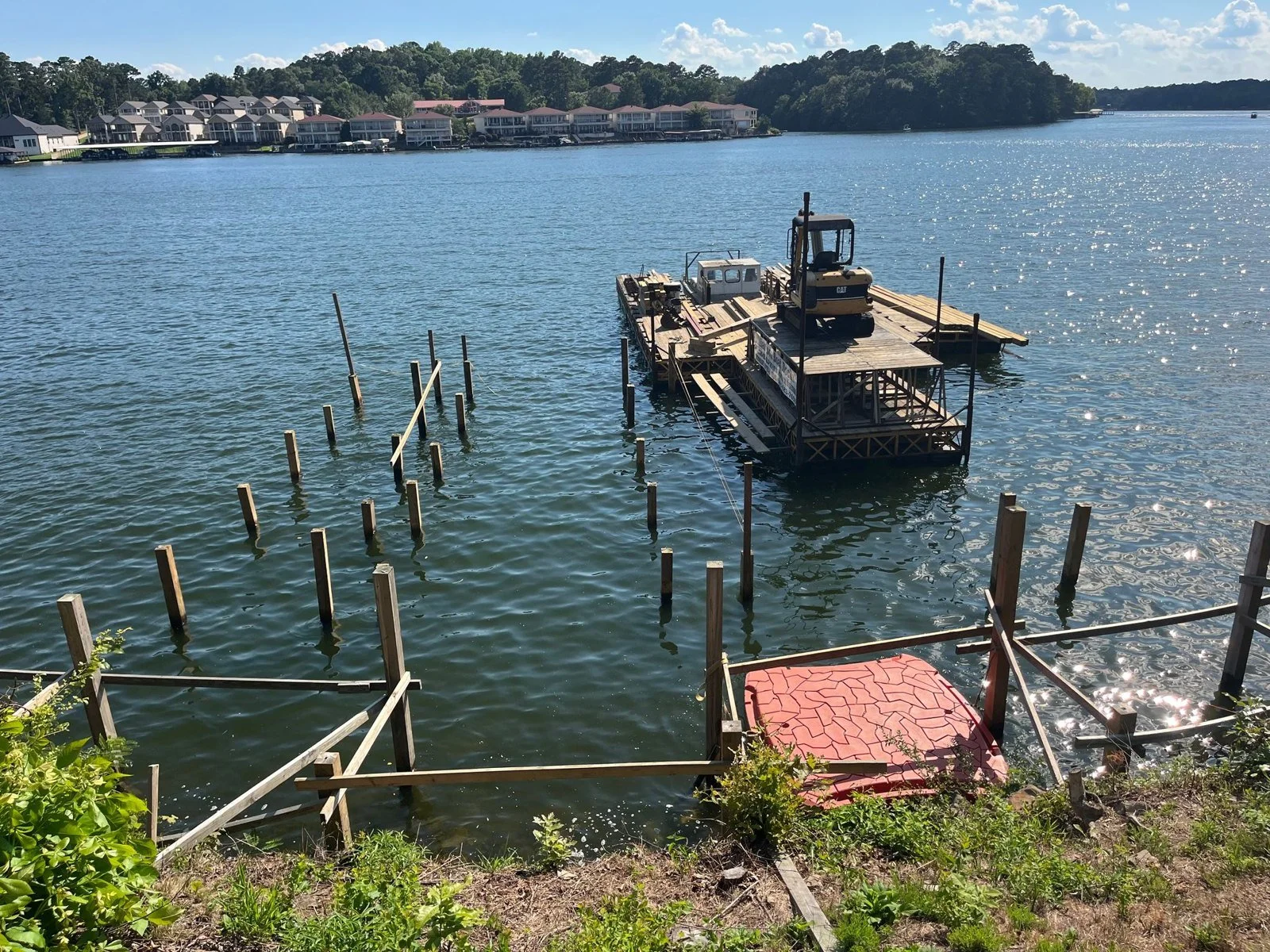 Pilings set from the barge for a large dock at Hamilton Heights
