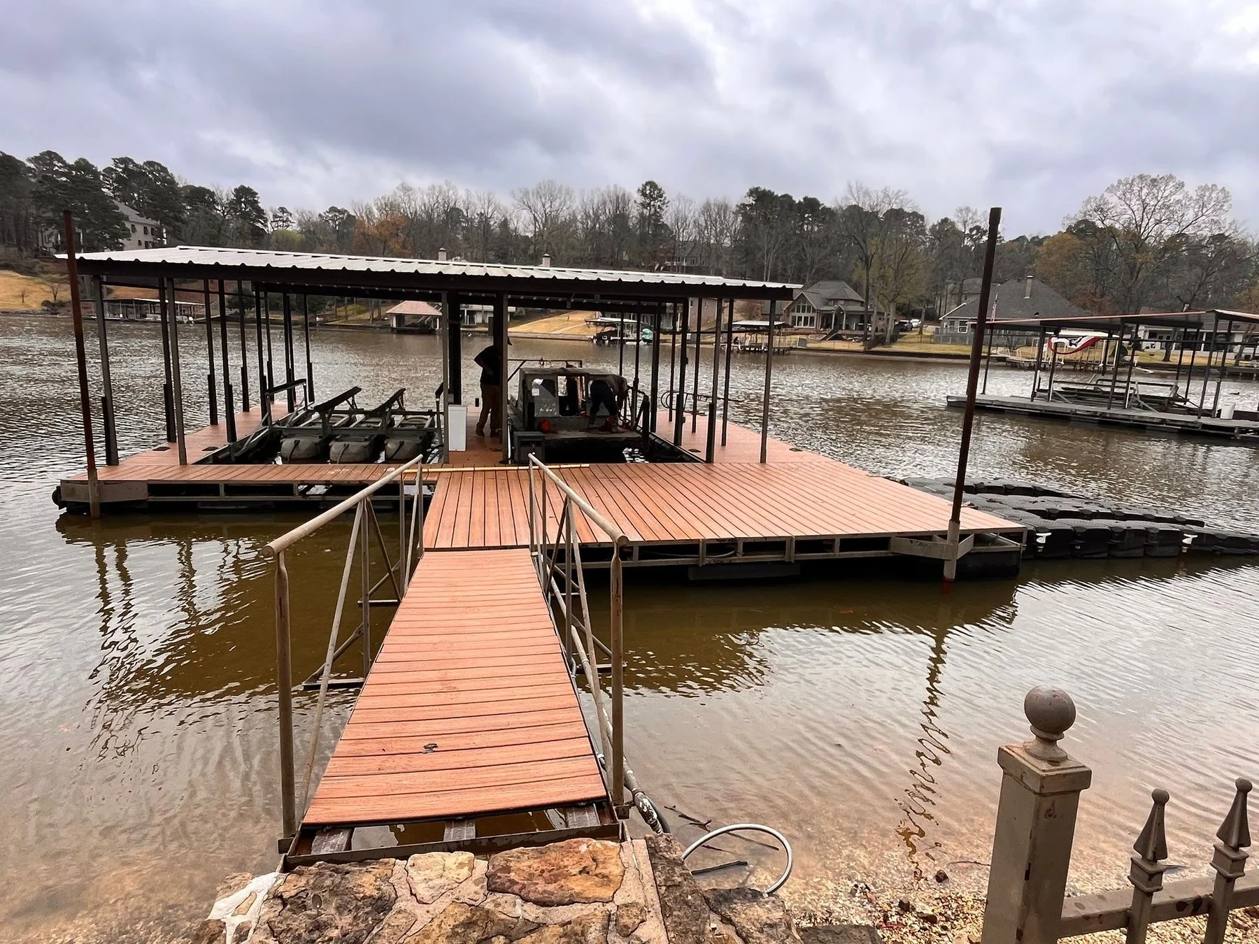 Williamson Boat Docks crew working a floating dock during a drawdown move