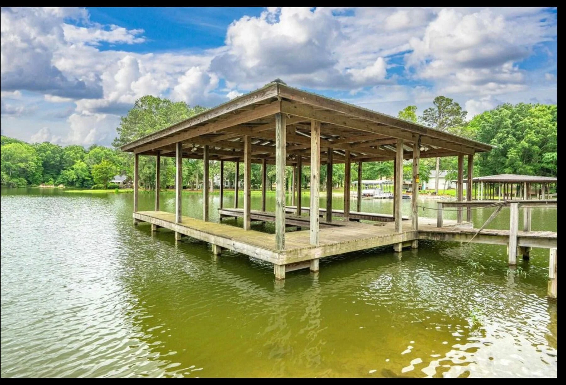 Covered boat dock on a quiet cove, Lake Hamilton