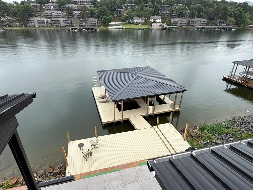 Covered boat dock and walkway seen from the shoreline, Lake Hamilton