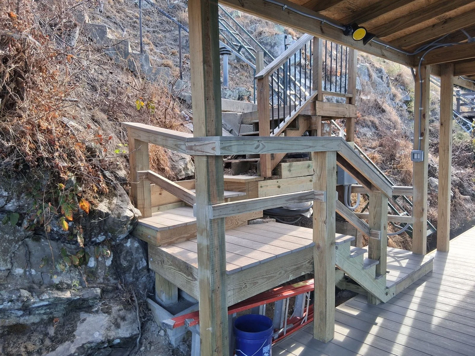 Stairs built into a rock bluff down to the dock at Cougar Terrace