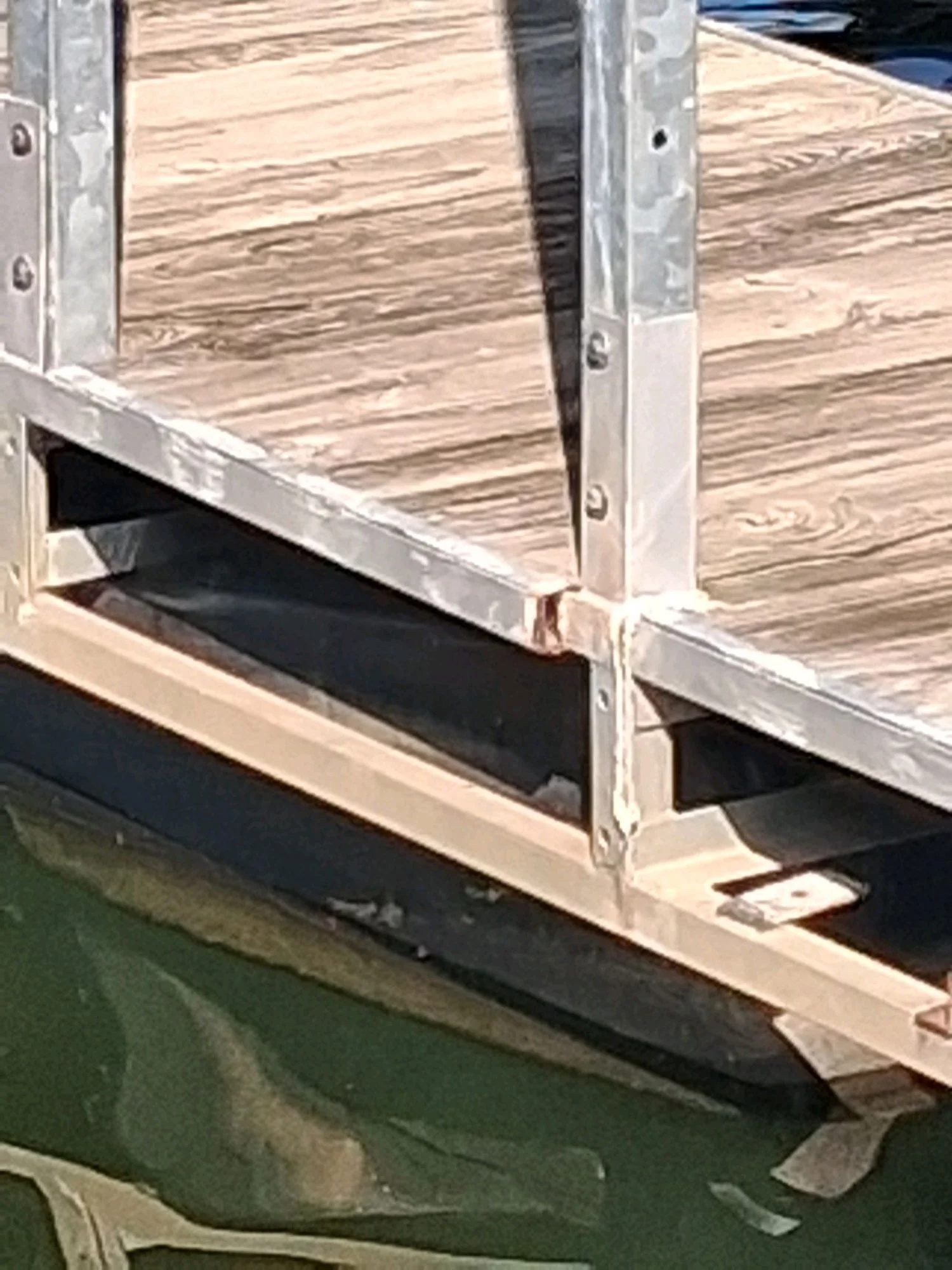Replacement galvanized steel frame and new decking seen from the water