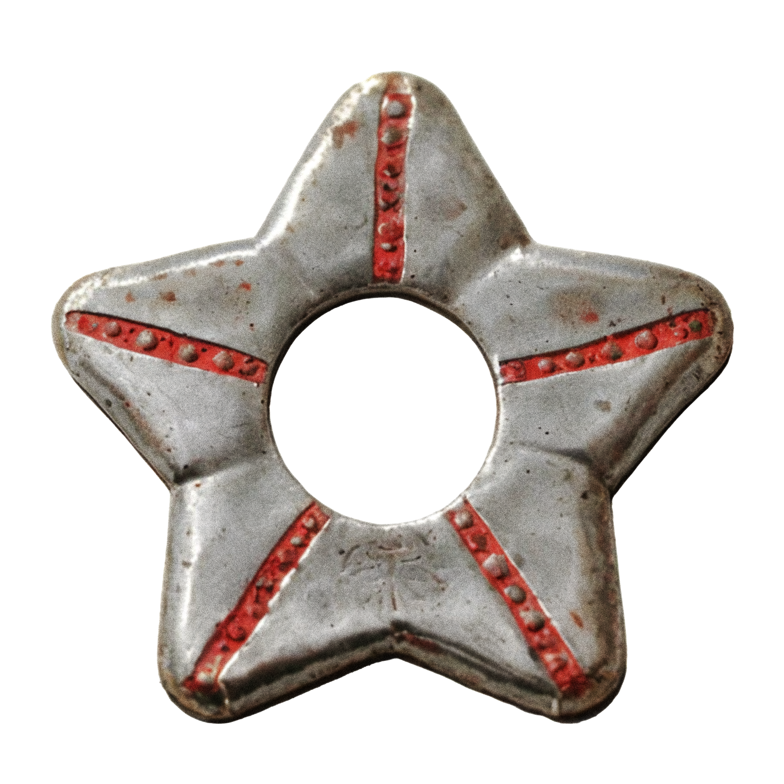 Close-up of a metal star-shaped object with red markings and text on its points.