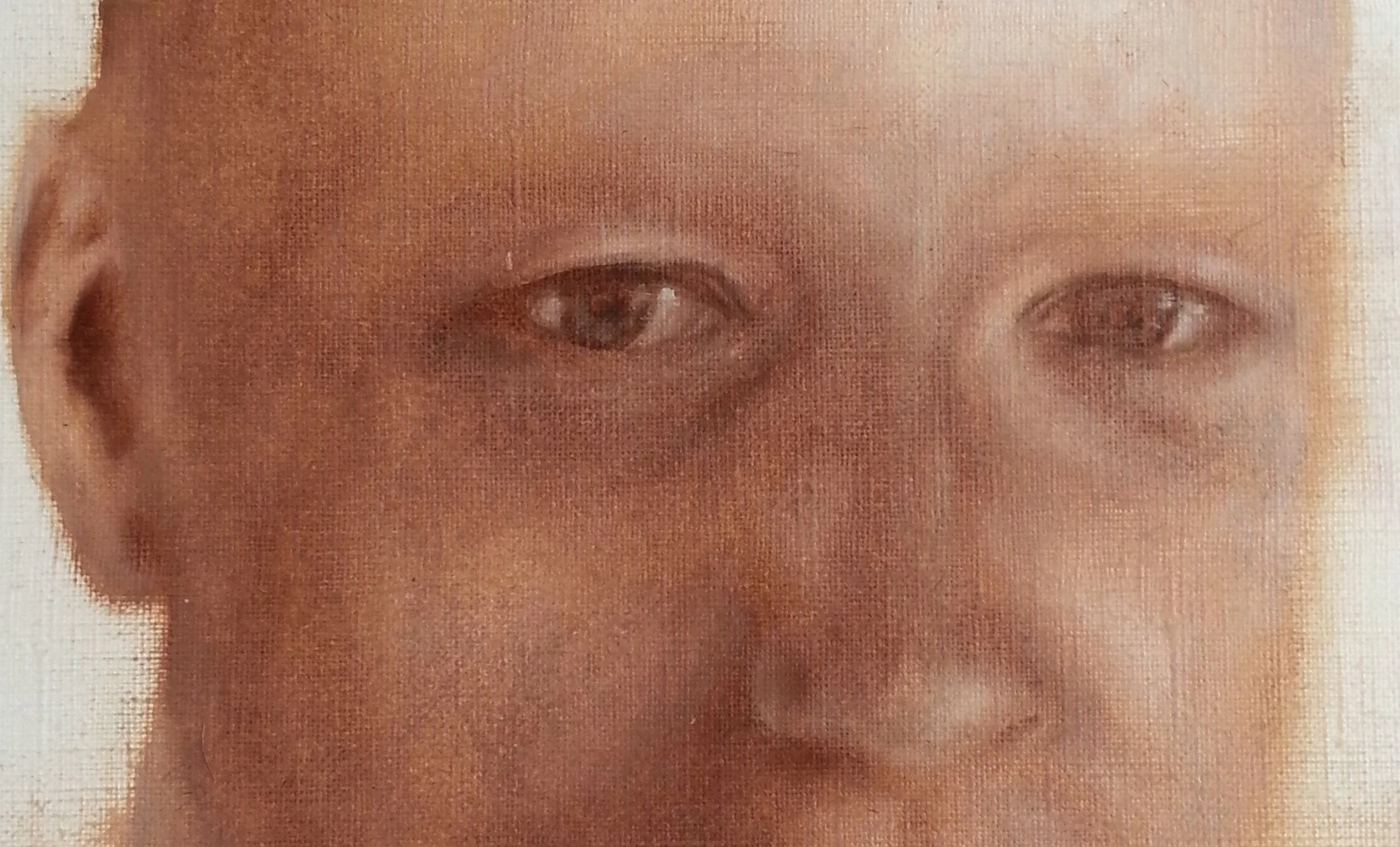 Close-up van een geschilderd gezicht met nadruk op de ogen en wenkbrauwen.