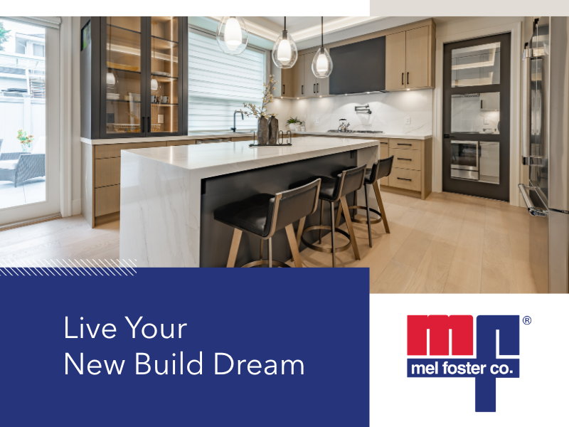 Modern kitchen with white island, black bar stools, light wood cabinetry, stainless steel appliances, pendant lighting, and a sliding glass door.