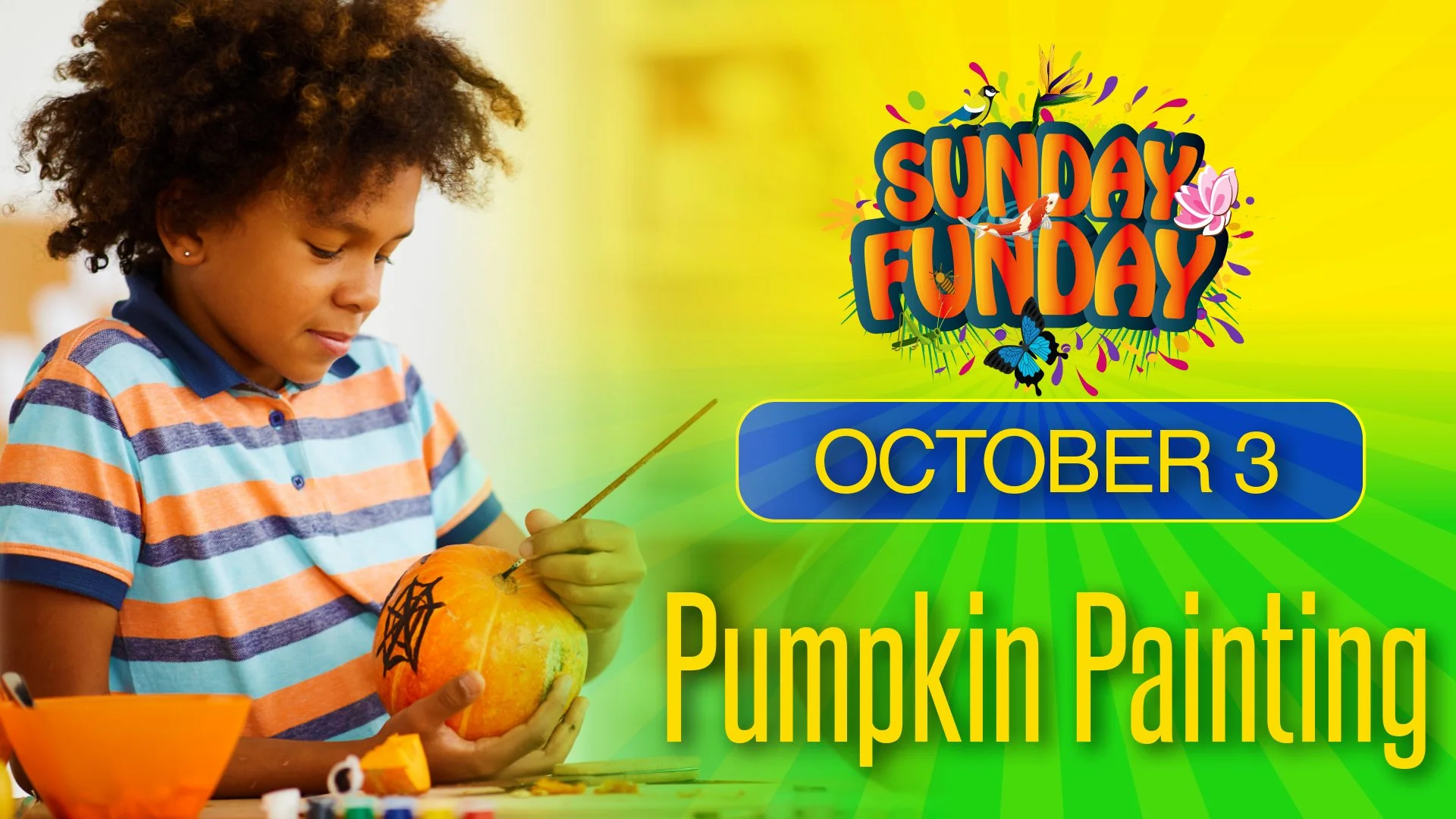 A young girl with curly hair wearing a striped orange, blue, and white shirt is painting a pumpkin with a spider web design while participating in a pumpkin painting activity for Sunday Funday on October 3rd.