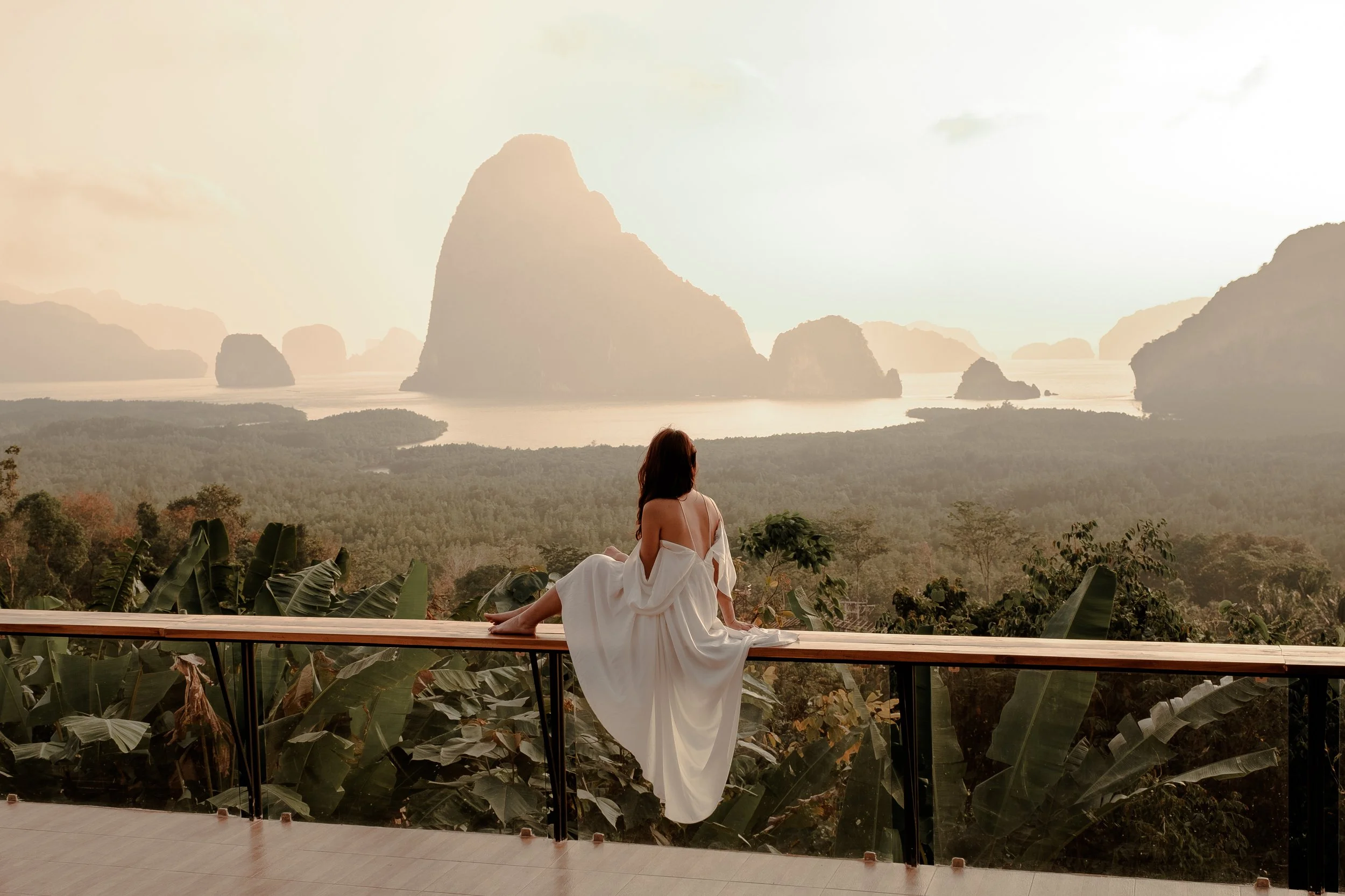 Luxurious woman on vacation looking at the mountains
