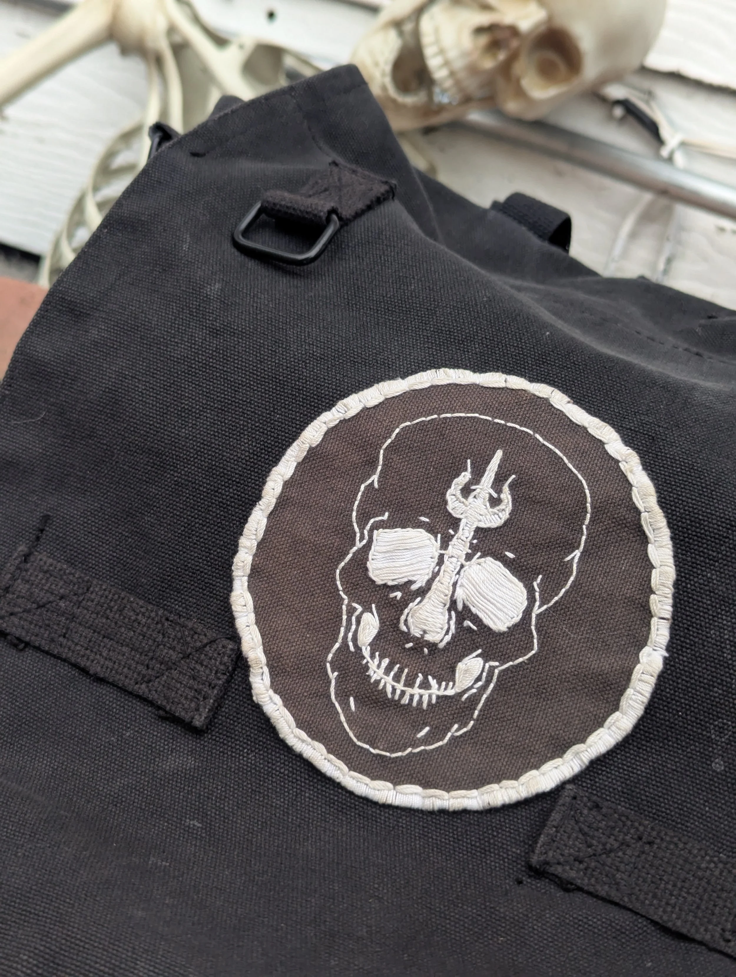 Logo patch sewn on a bag