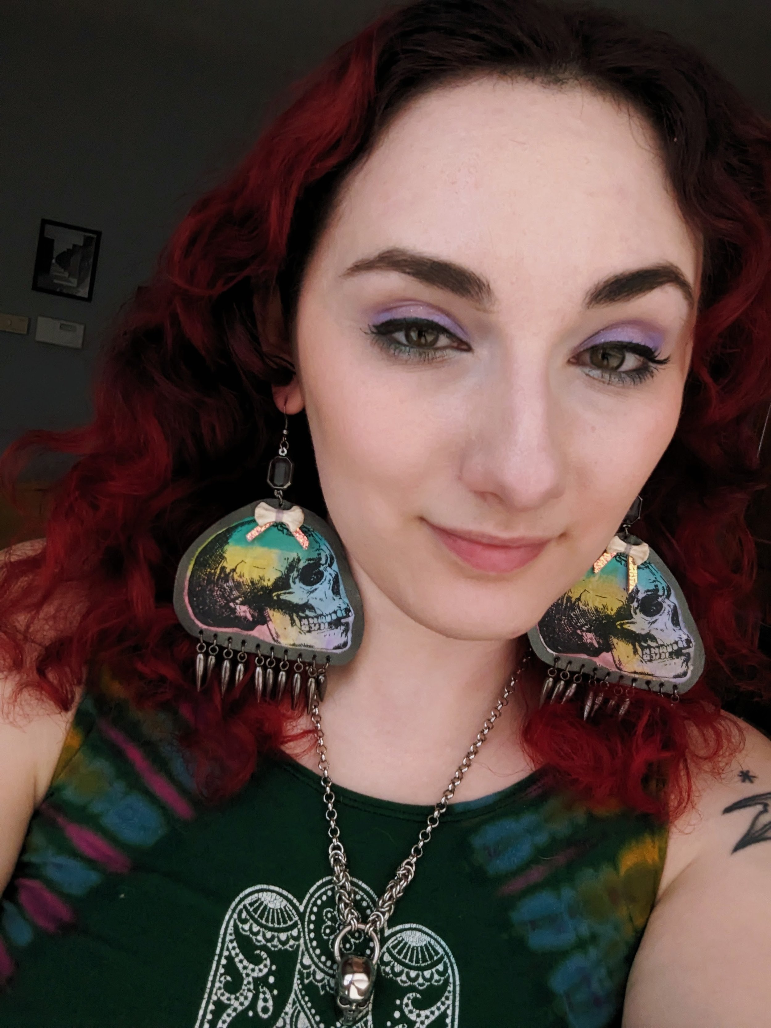 Earrings made from scrap leather, fabric, beads, and bone