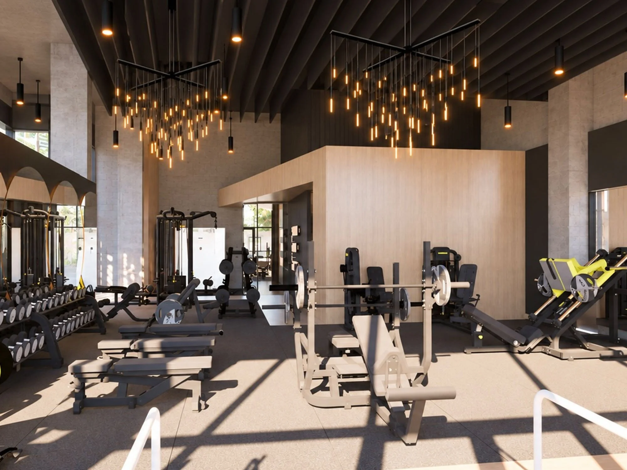 Gym with various equipment and modern lighting fixtures.