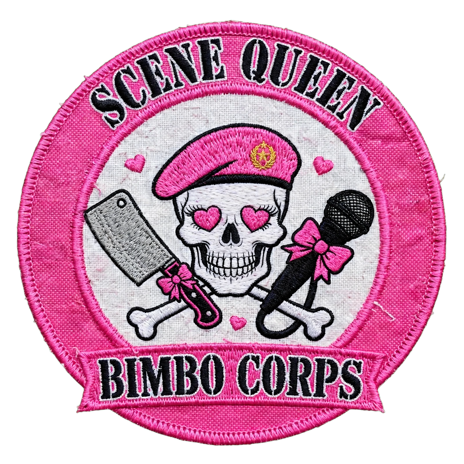 Scene Queen Bimbo Corps logo shown as an embroidered pink patch with a skull in a pink military beret and heart eyes.  The skull is flanked by a crossed meat cleaver and microphone tied with pink bows.