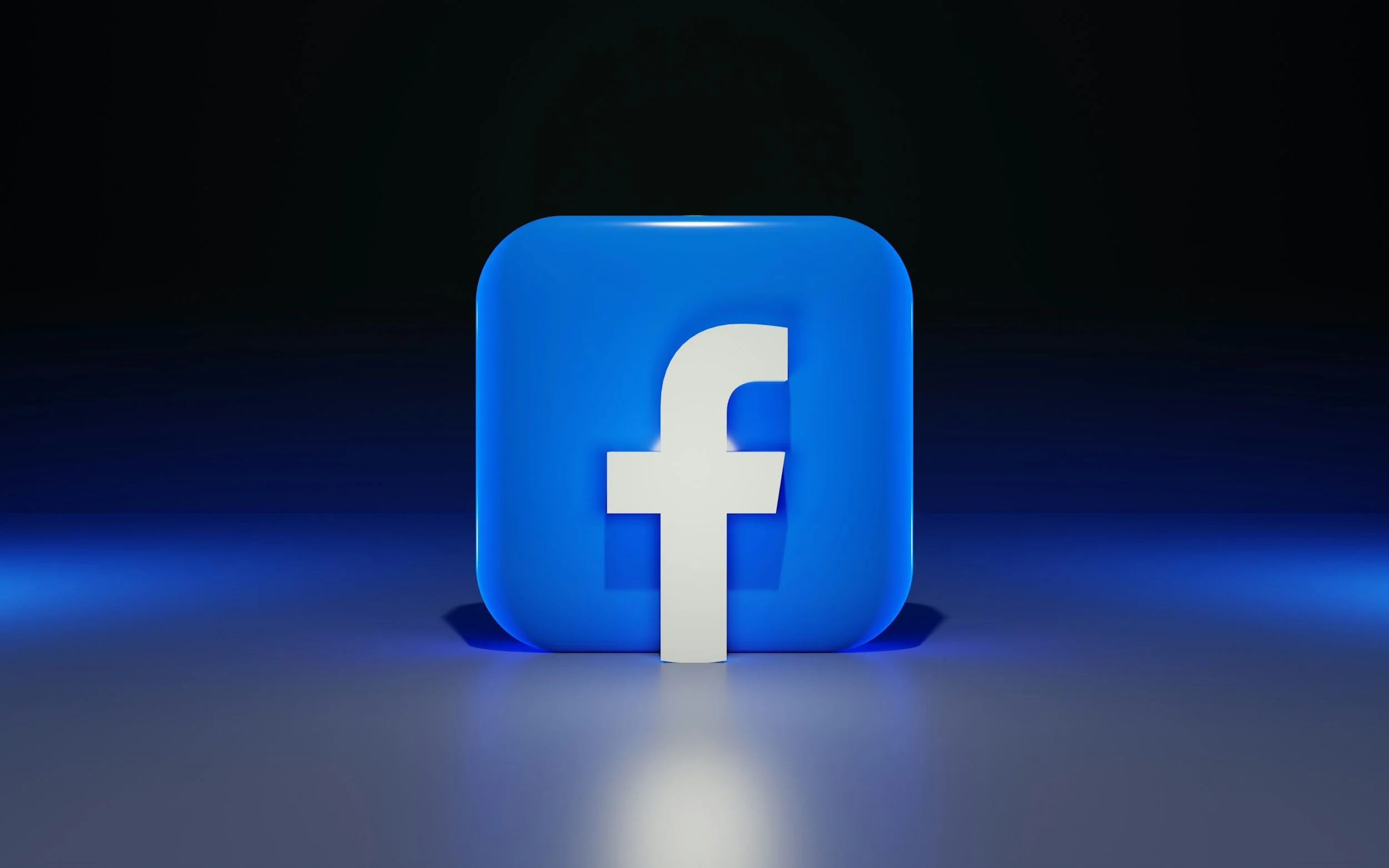 A glowing Facebook app icon in blue with a white lowercase 'f' in the center, set against a dark background with a blue gradient glow.