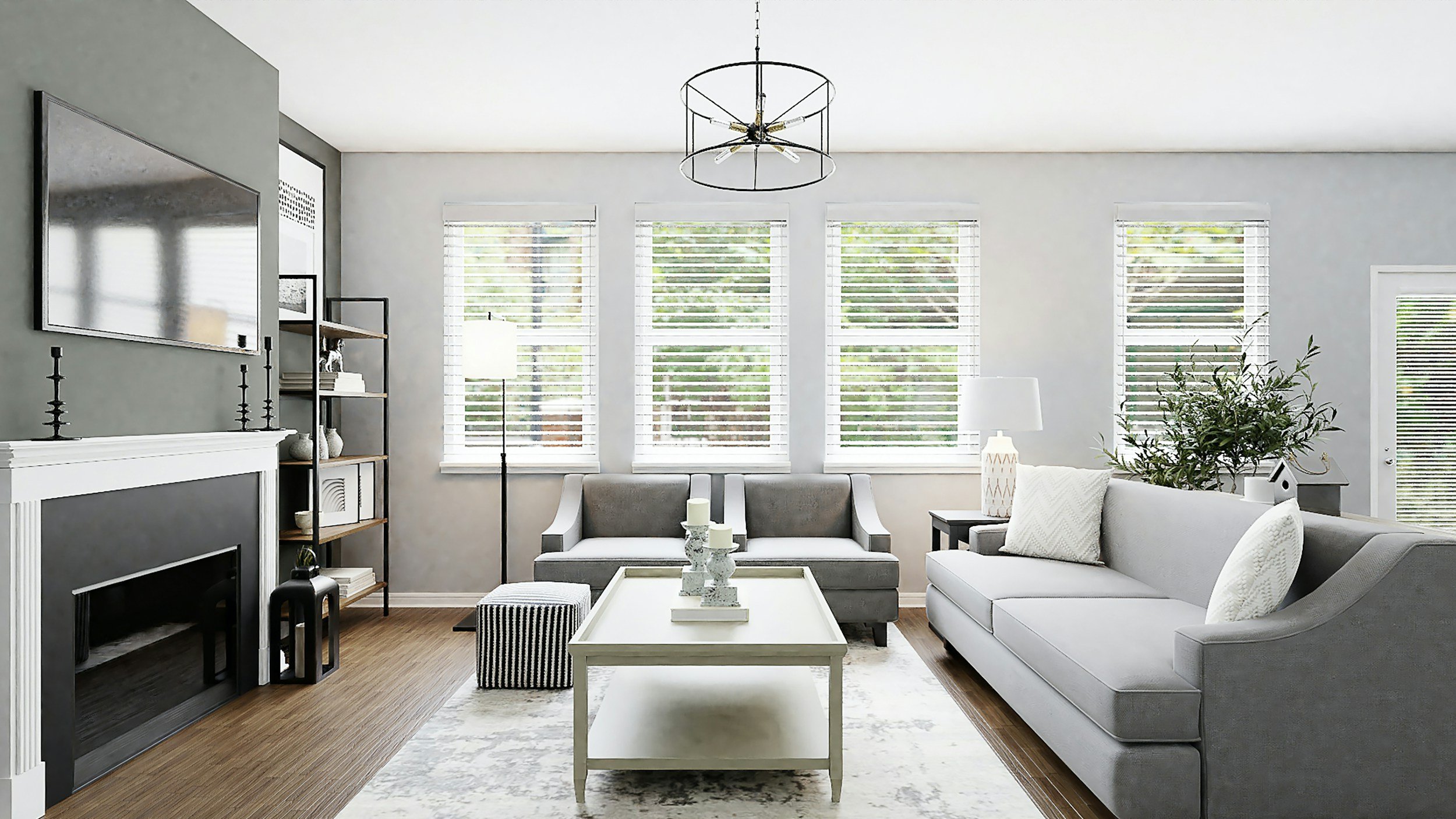 Bright living room with white walls, large windows with blinds, gray and white furniture, a coffee table, and decorative items.