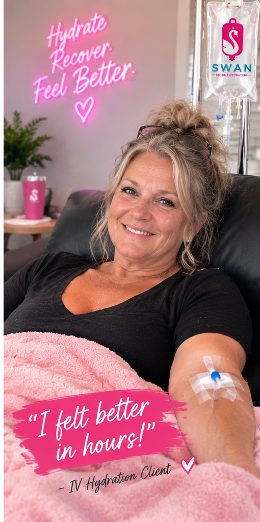 A woman with blonde hair and glasses on her head smiling while lying on a hospital bed with IV hydration in her arm. A neon sign in the background reads 'Hydrate Recover Feel Better' with a heart symbol. There is a pink blanket over her legs and a pink cup on the side table. The image promotes hydration therapy.