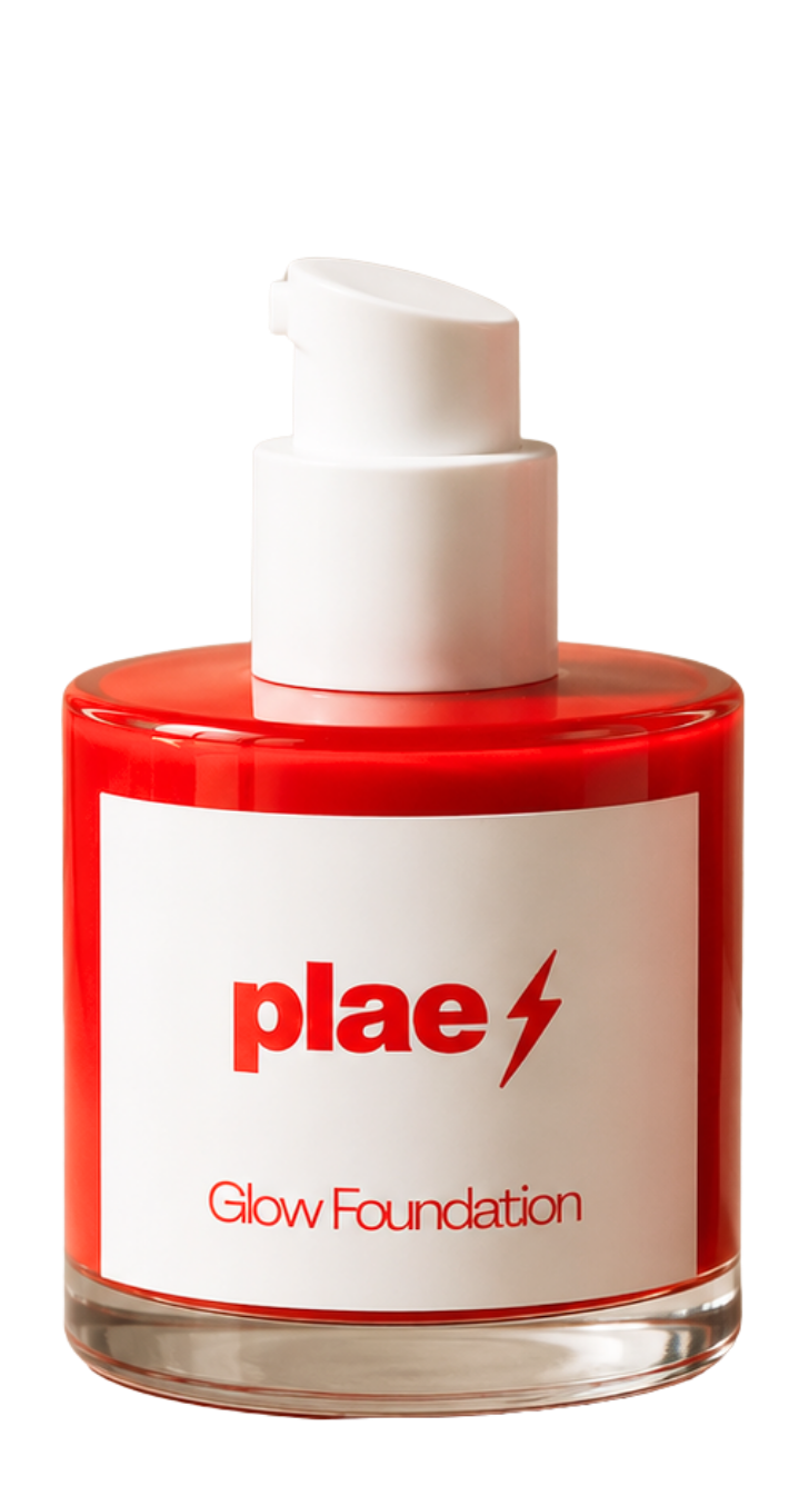A red jar of glow foundation with a white pump dispenser and label that reads "plae" with a lightning bolt symbol and "Glow Foundation" underneath.