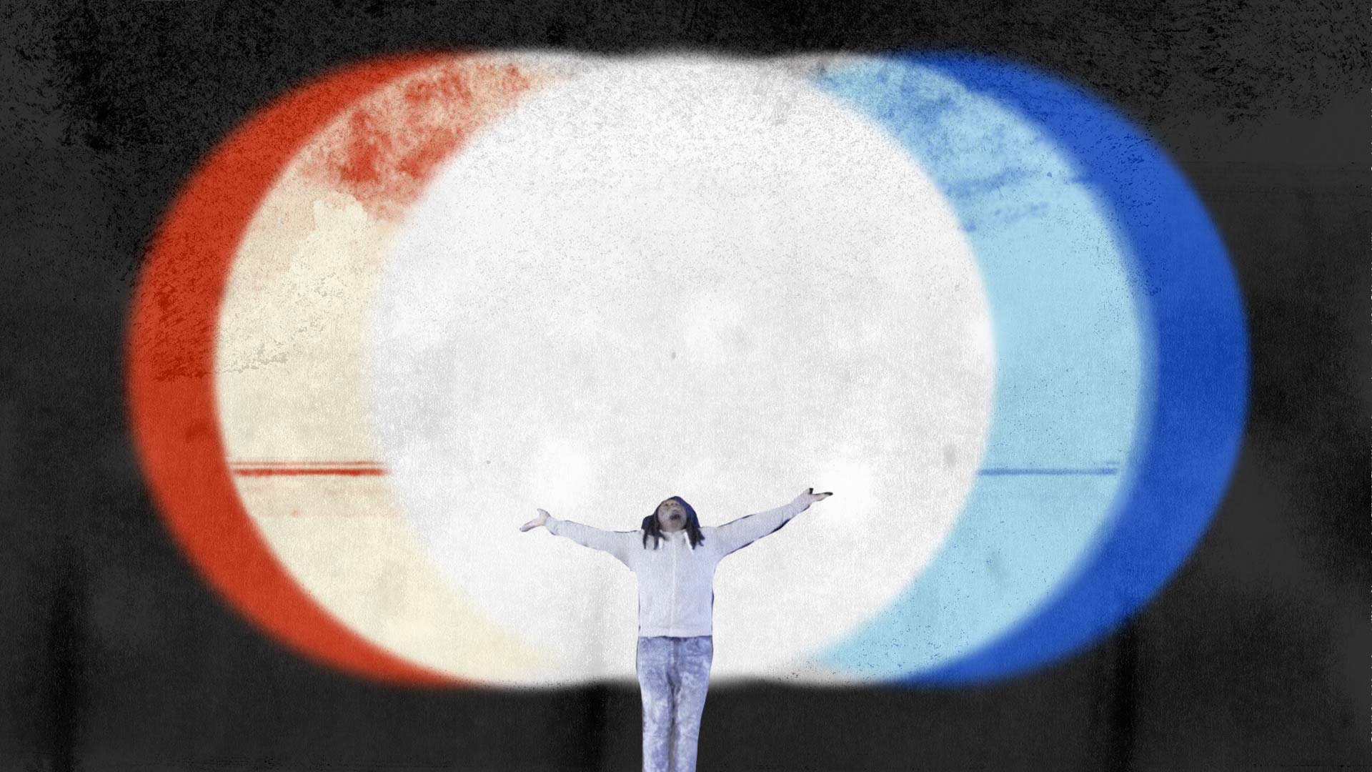 Darius spreads his arms wide in a glow of light edged in red and blue — The Power of Proximity, Skoll World Forum.