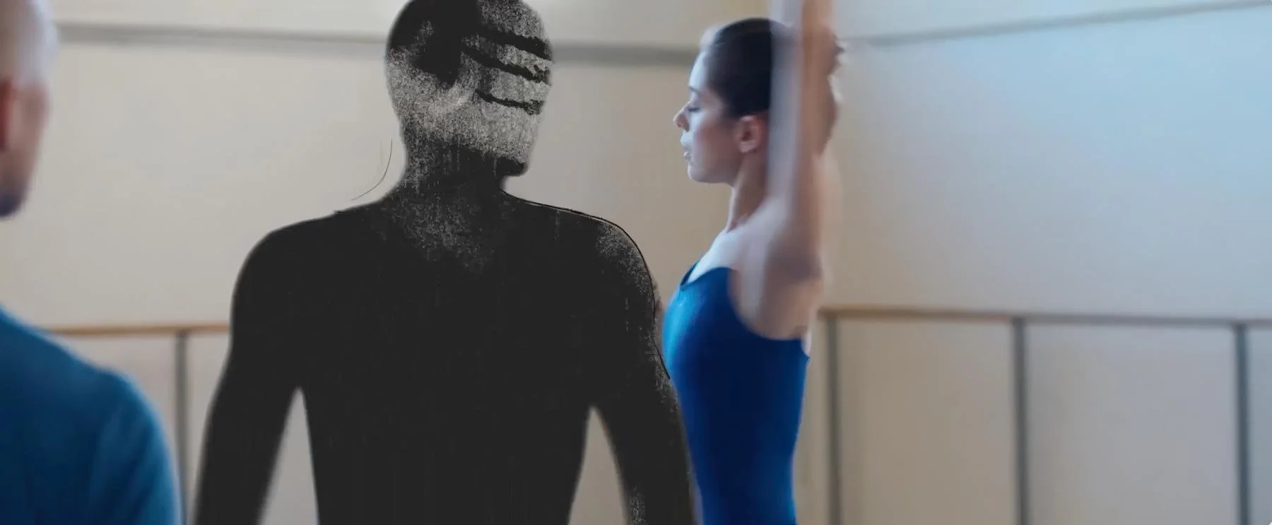 A dark, textured drawn figure stands beside the ballerina as she raises her arm — The Shimmering Asphalt, New York City Ballet.