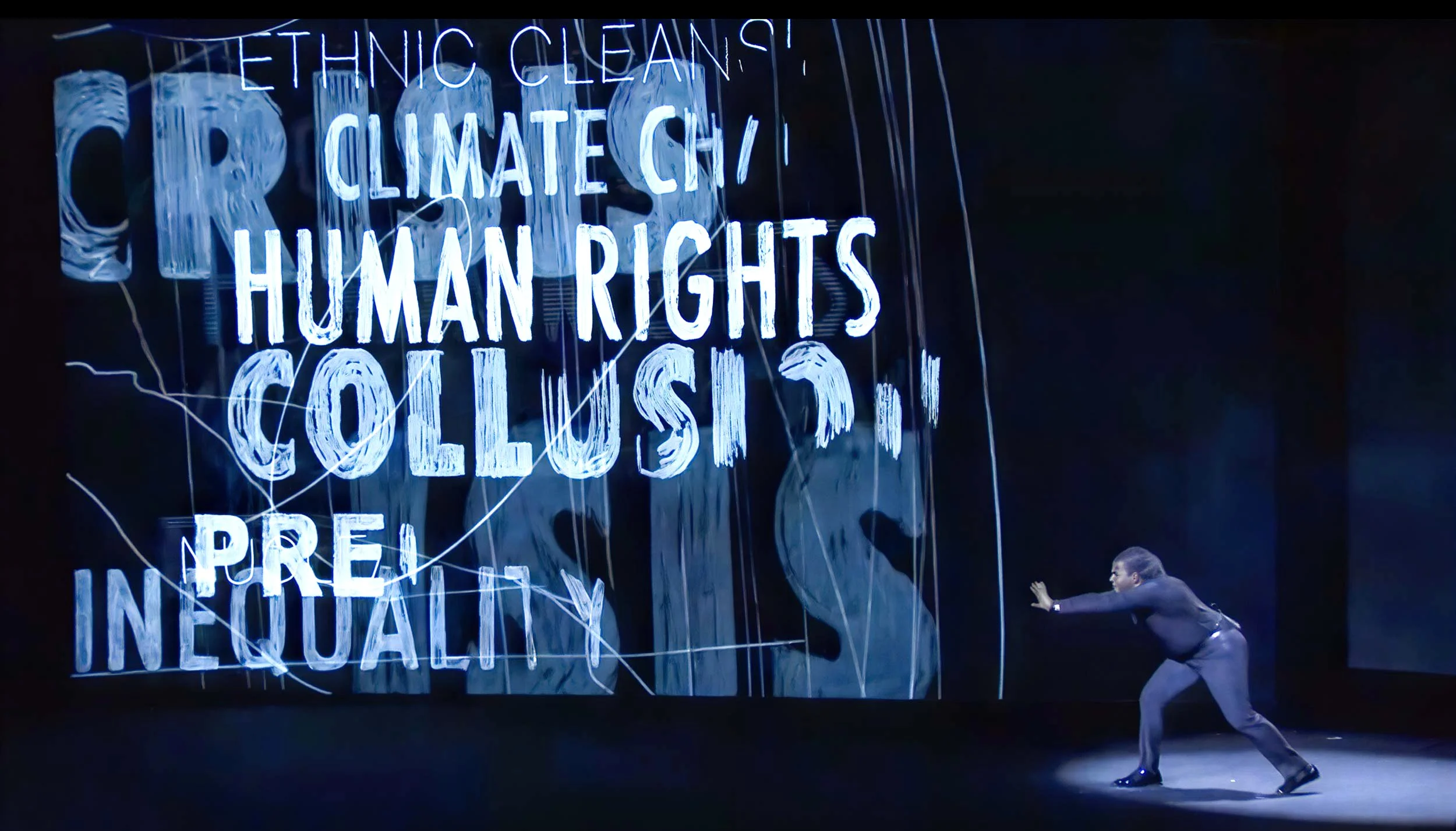 Darius pushes the words and phrases climate change, collusion, ethnic cleansing, inequality and human rights on stage — The Power of Proximity, Skoll World Forum.