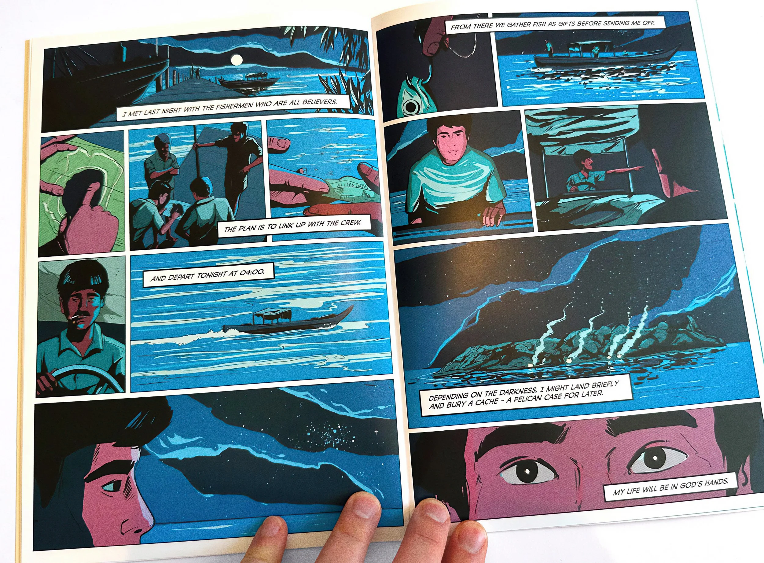 A night-time comic spread in deep blues: John meets the fishermen, pays them, and sets out by boat at 4 a.m. toward the island, where fires burn along the shore. The final caption reads "My life will be in God's hands." — The Mission, National Geogra