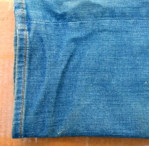 Fabric: the folded hem of faded blue jeans — Worn Stories, Netflix.