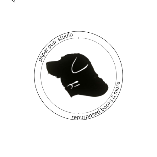 Silhouette of a dog's head inside a circular logo with text around it.
