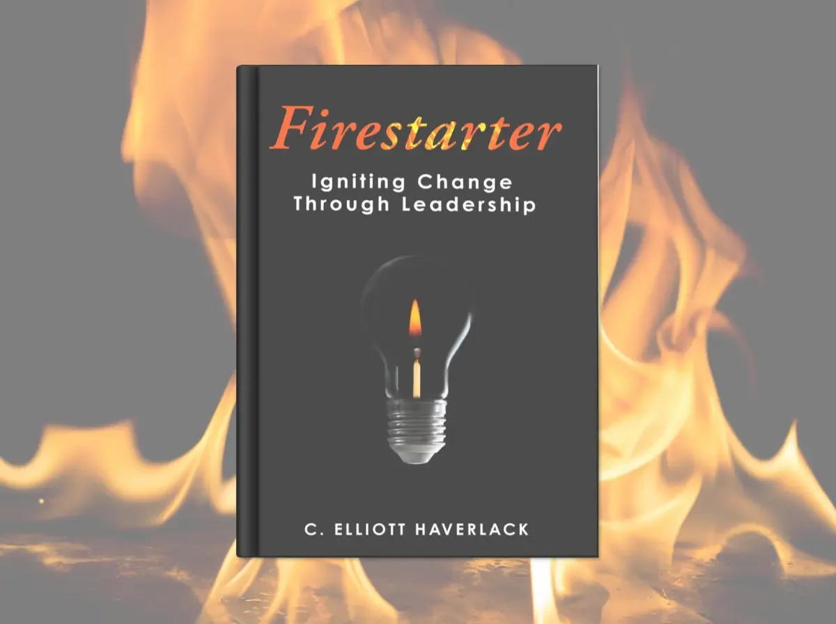 The Firestarter book by C. Elliott Haverlack. Set against a background of flames.
