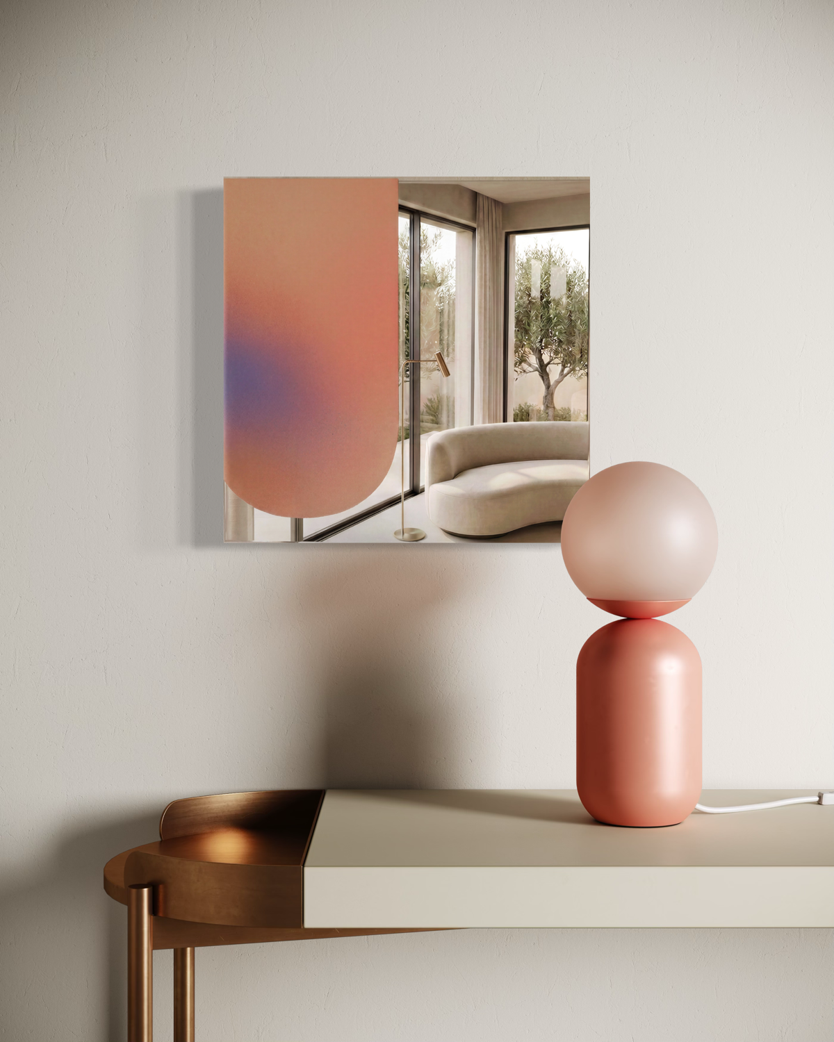 Spiegel Artwork hängt in modernem Raum mit Dekorationsleuchte aus geometrischen Formen in Rosatönen.