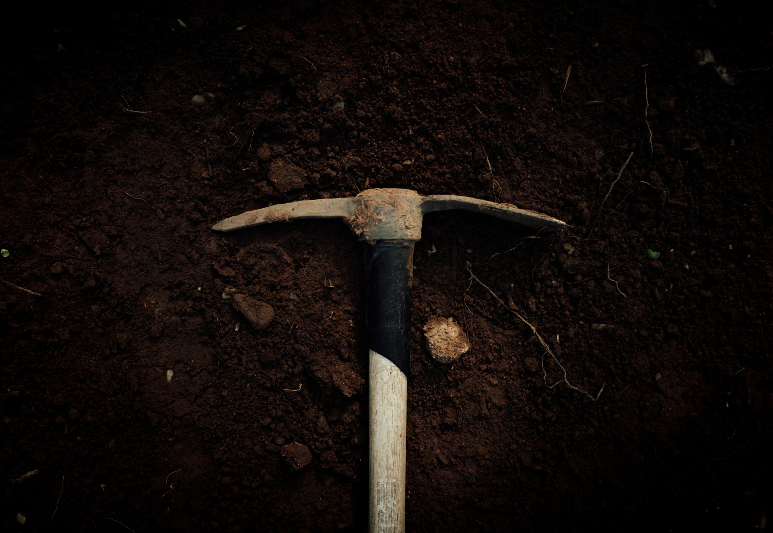 Pickaxe on dirt, highlighting that I'm a geologist.