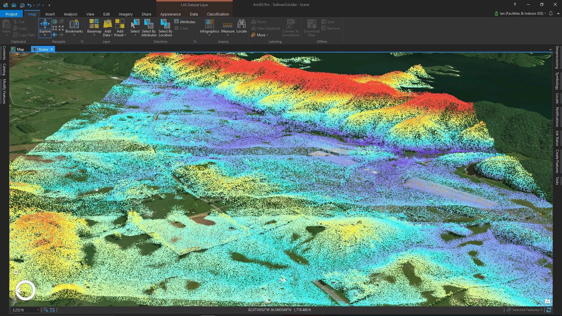 A 3D topographic map with multicolored elevation points over a landscape showing hills, water bodies, and vegetation in a rural area.