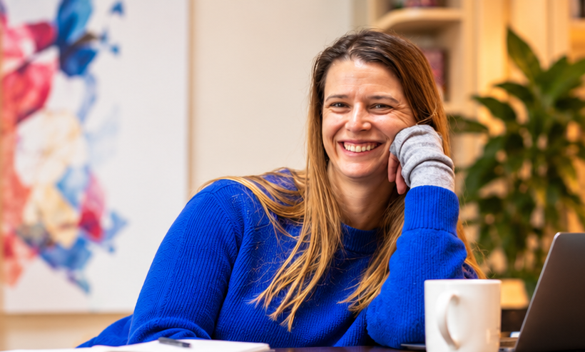 DYC_BRAND_003_Meghan-BlueSweater-Office-Portrait.png