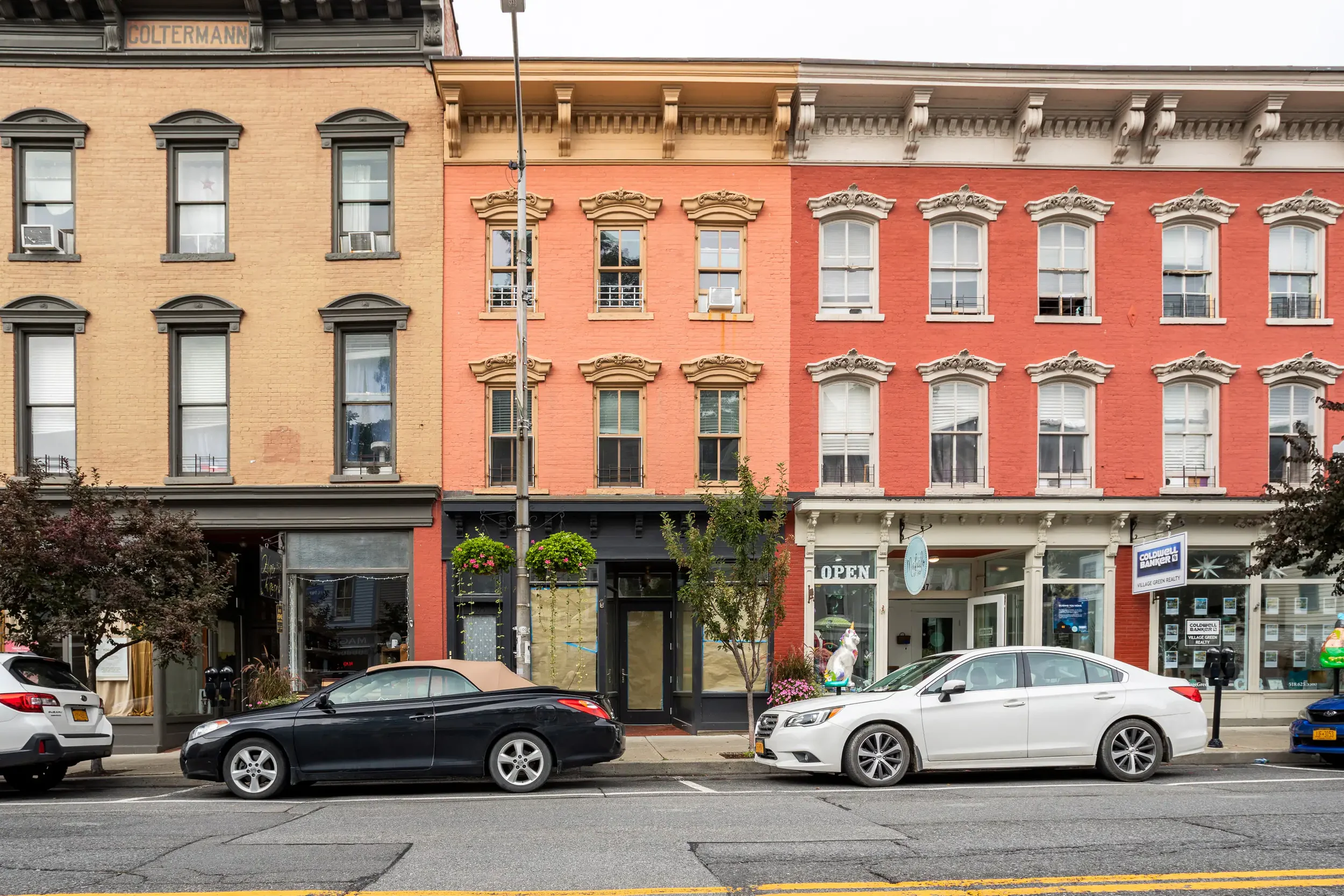 Exterior of our vacation apartment building at 395 Main Street in historic Catskill Village, New York, with shops and restaurants nearby.