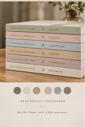 Six stacked books titled "Beautifully Unfinished," with titles "Steady," "Enough," "Untangled," "Rooted," "Connected," and "Becoming." A blurred vase of white flowers is in the background and a color palette below the books shows six muted colors.