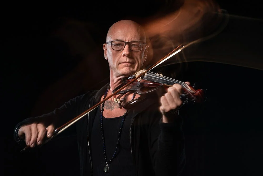 Sage Rader playing a violin