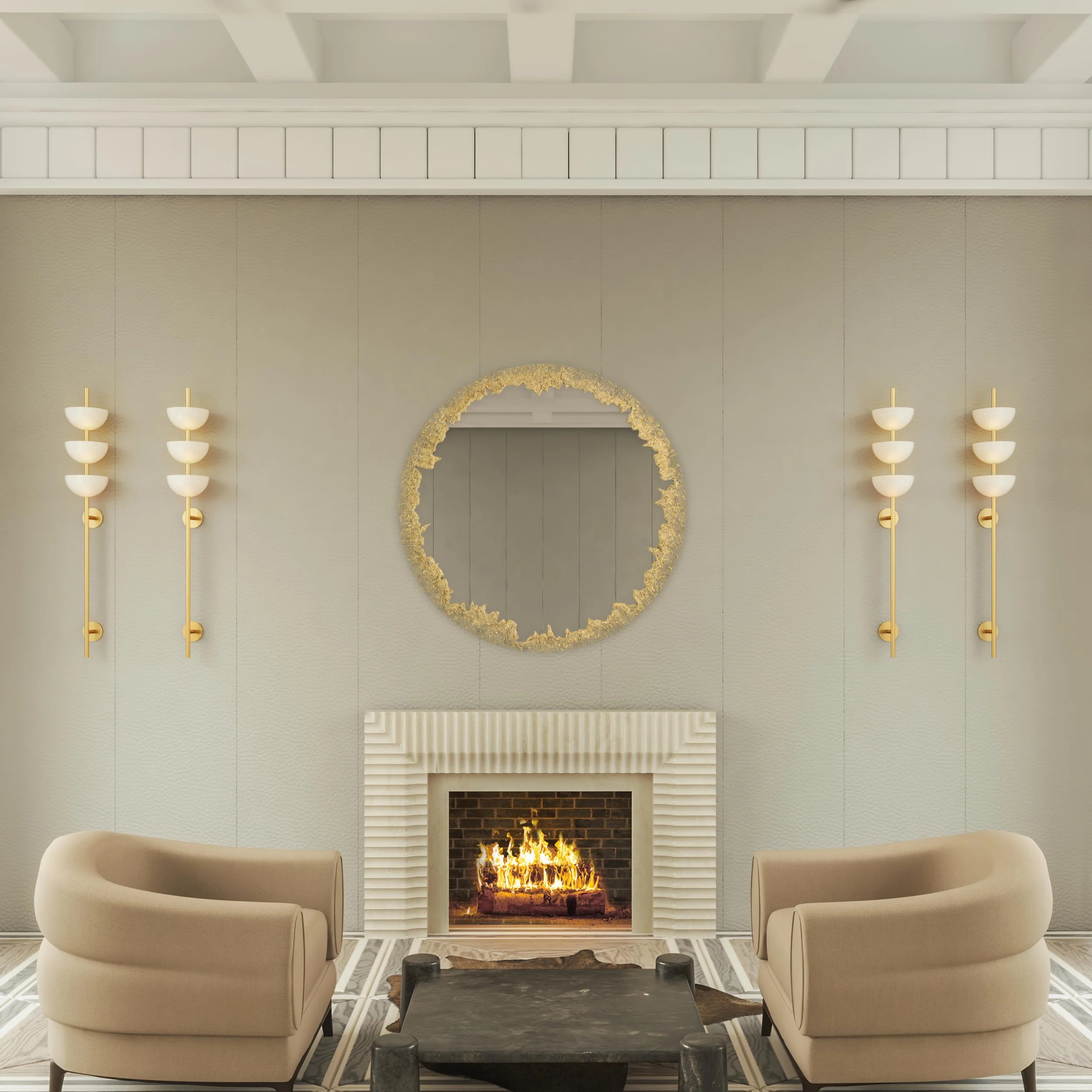 A living room with a fireplace, two beige EnVie Collection Isabelle armchairs, a black marble coffee table, and a gold decorative mirror above the fireplace.