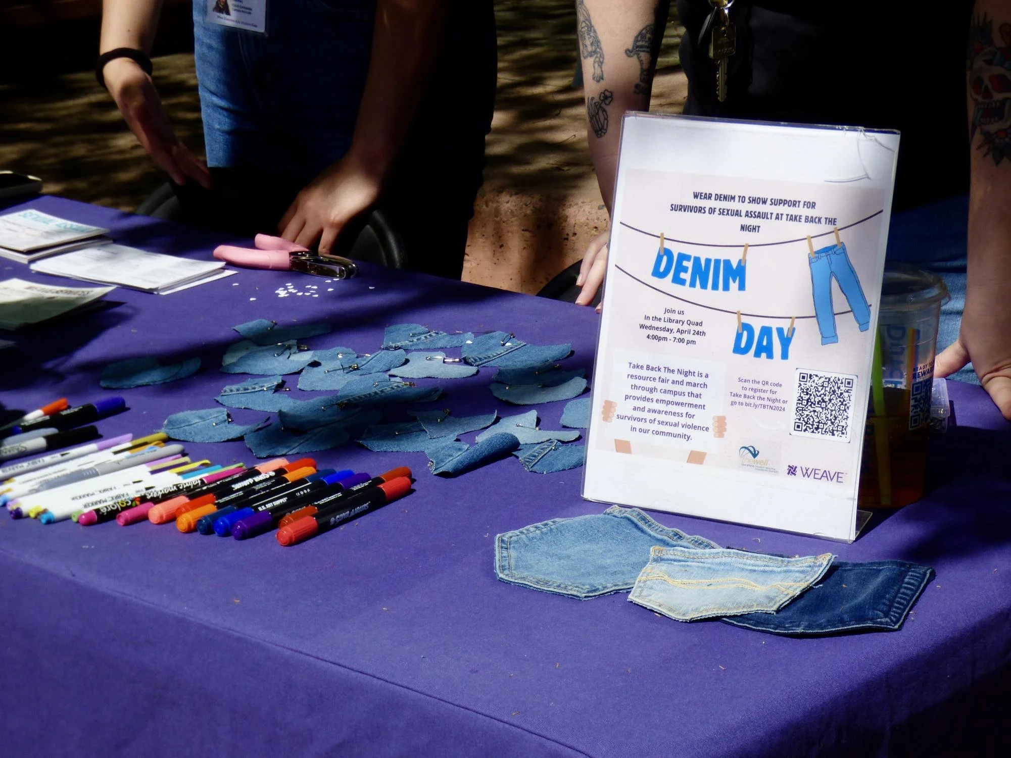  WEAVE teaches students about Denim Day, in which participants wear denim on the last Wednesday of Sexual Assault Awareness Month to educate others about sexual assault Tuesday April 2, 2024. The booth provided cut out denim hearts for students to we