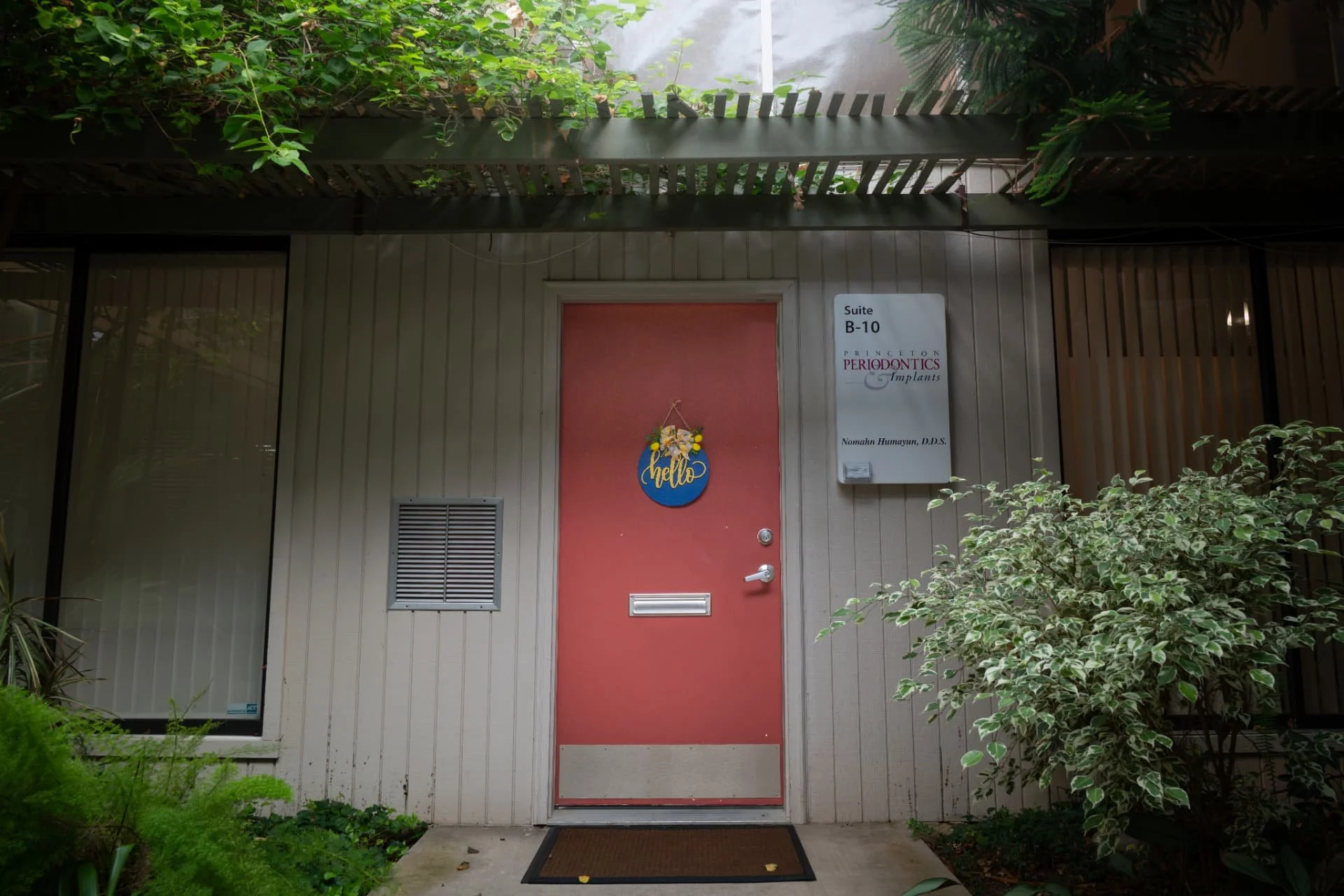 Coral entrance door at Suite B-10