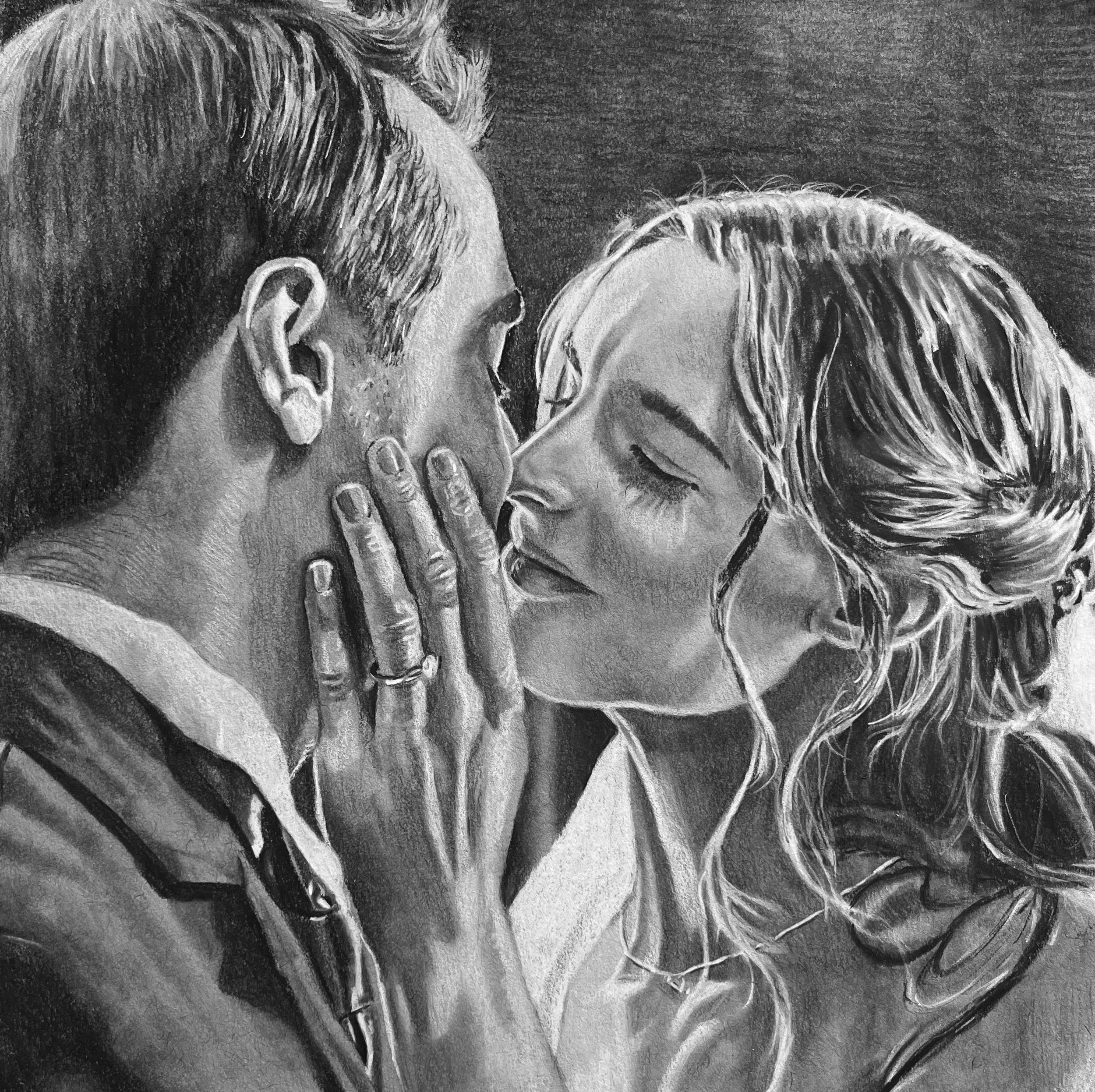 A black and white charcoal drawing of a couple sharing a close, intimate moment, with their foreheads touching and eyes closed.