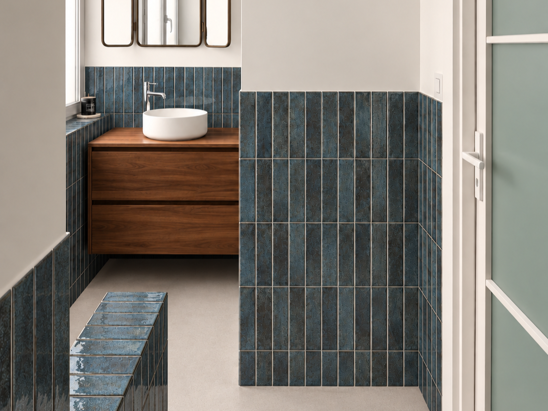 Handmade blue rectangular tile installed throughout a modern bathroom.