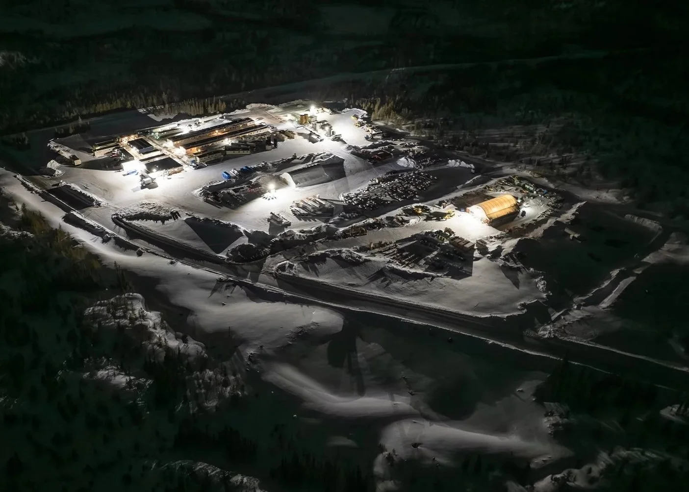 Aerial view of the camp lit up at night