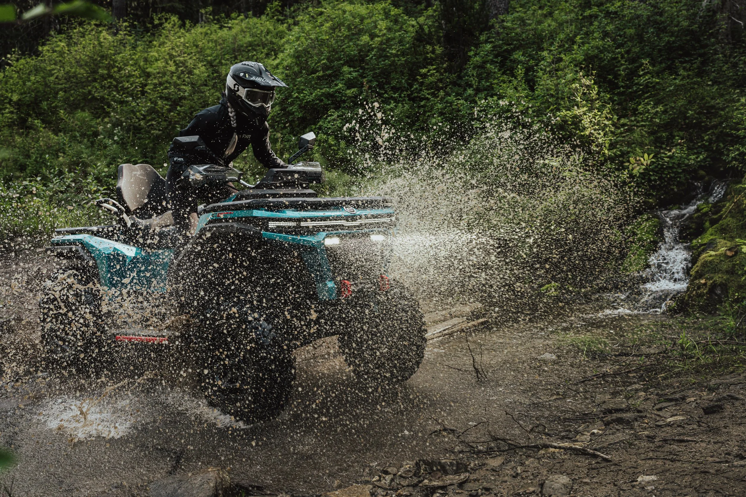 CFORCE ATV rider through the water, Valemount, BC